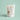 "Minimalist product shot of Flower Power dog treats with soft pastel background, emphasizing the natural and clean label ingredients."