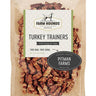 A bag of 100% dehydrated turkey dog treats with an easy-break shape, highlighting their high-protein, all-natural ingredients sourced from American family farms.