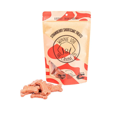 A bag of Strawberry Shortcake Biscuits with fresh strawberries and beets beside it, highlighting the organic, fruit-filled ingredients.