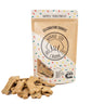 Bag of Celebration Cookies with Dog Treats – A festive bag of all-natural, grain-free Celebration Cookies for dogs, made with organic banana, honey, and coconut sprinkles.
