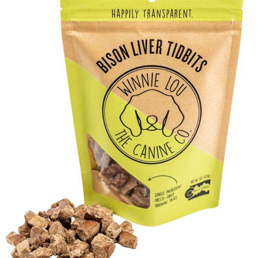 A yellow resealable bag of Bison Liver Tidbits by Winnie Lou - The Canine Company, featuring a playful dog logo and product details.