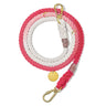 A beautifully handcrafted coral ombre cotton rope dog leash, featuring a soft gradient from peach to coral, solid brass bolt snaps, and an individually numbered tag for durability and style.
