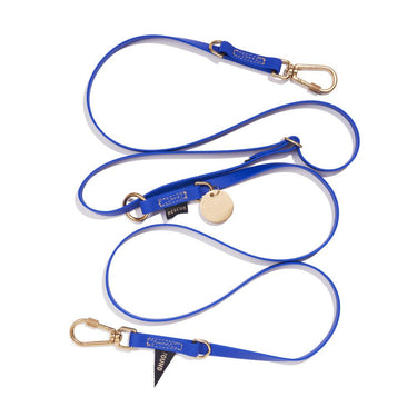 Bright blue 7ft water-resistant dog leash by Found My Animal, made from durable rubber-coated webbing with brass lockable carabiners, offering adjustable versatility for hands-free or multi-dog walking. Supports pet rescue and adoption.
