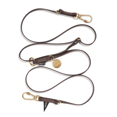 Brown 7ft water-resistant dog leash by Found My Animal, made from durable rubber-coated webbing with brass lockable carabiners, designed for adjustable, hands-free, and multi-dog walking. Supports pet rescue and adoption.