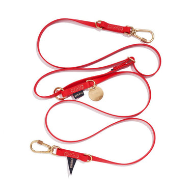 Bright red 7ft water-resistant dog leash by Found My Animal, made from rubber-coated webbing with solid brass lockable carabiners and an adjustable design for hands-free and multi-dog walking. Supports pet rescue and adoption.







