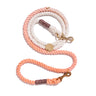 Peach cotton rope dog leash by Found My Animal, featuring solid brass bolt snaps, an adjustable design, and an individually numbered tag supporting pet rescue and adoption.